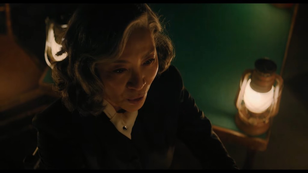 A Haunting in Venice Clip Shows Michelle Yeoh Calling Upon the Spirit of Alicia Drake