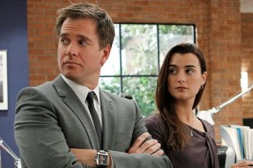 Michael Weatherly and Ziva David stand next to each other in NCIS.