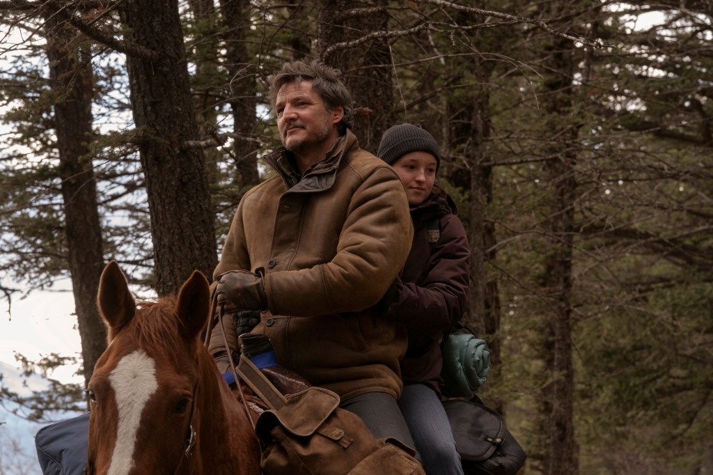 Joel and Ellie ride a horse in The Last of Us.