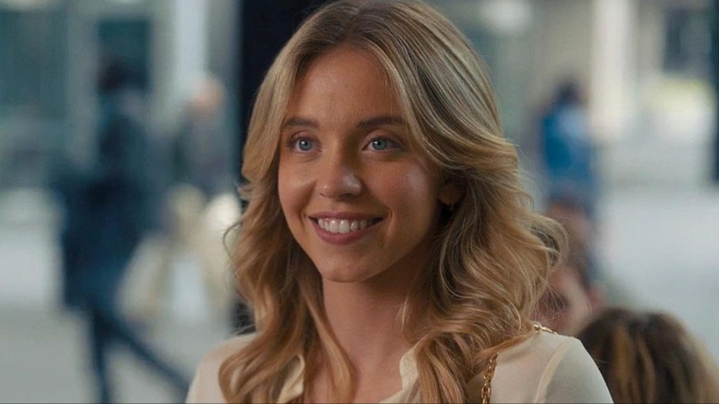 Sydney Sweeney smiles and stares.