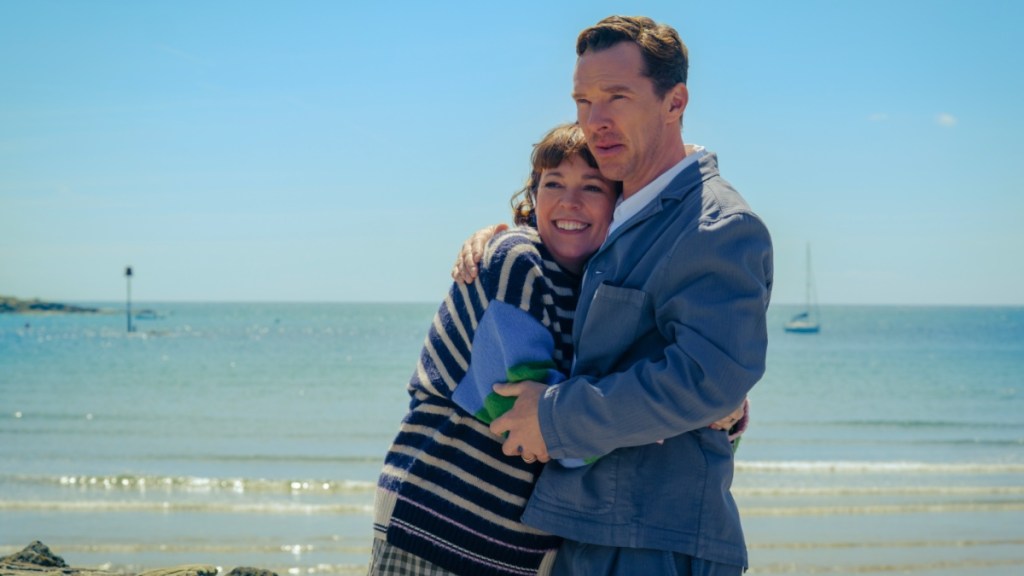 Olivia Colman hugs Benedict Cumberbatch.
