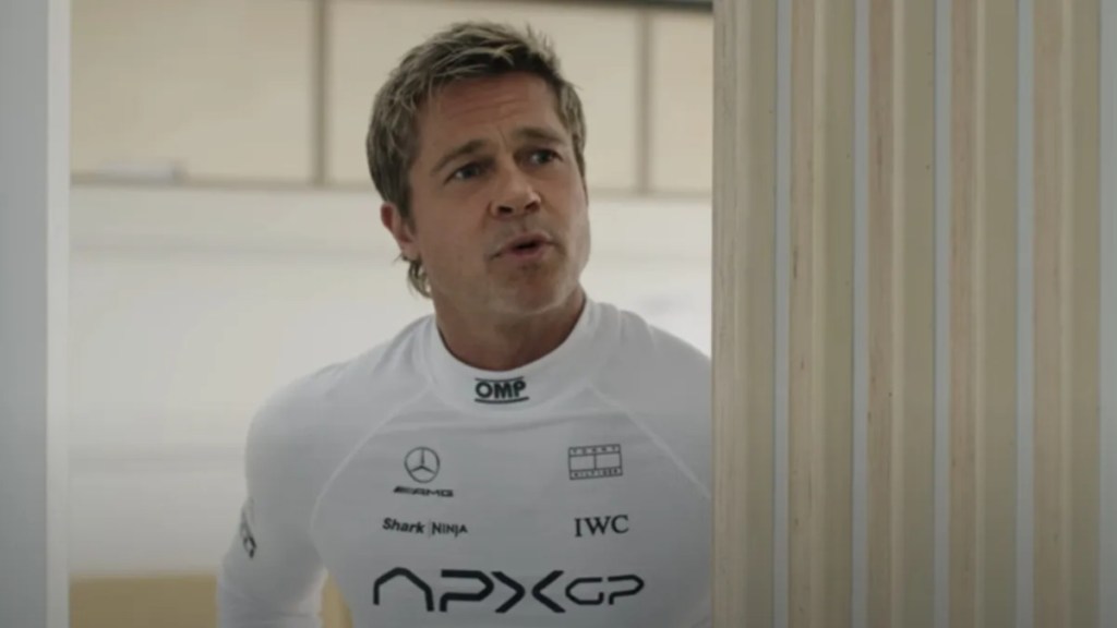Brad Pitt Wants To Chew on Press' Baby Mic at F1 Premiere