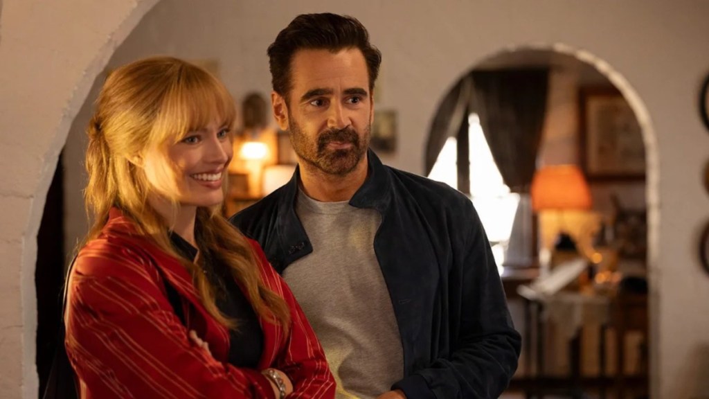 Margot Robbie and Colin Farrell stand and stare.