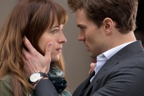 A man holds a woman's face.