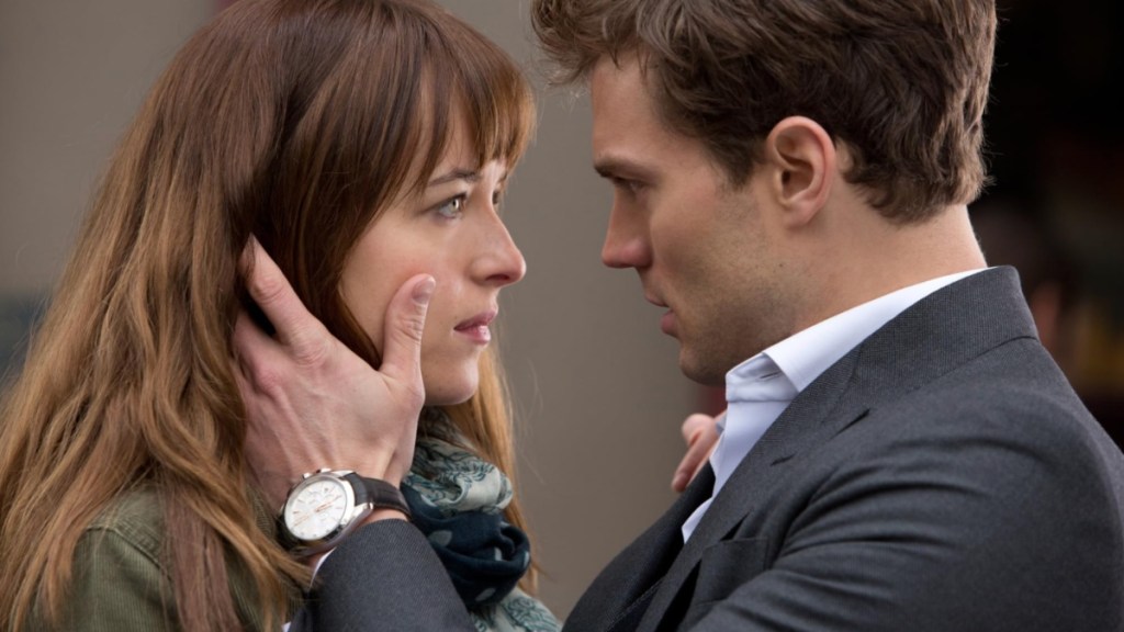 A man holds a woman's face.
