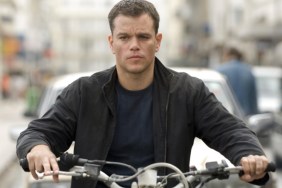 Matt Damon sits on a motorcycle.