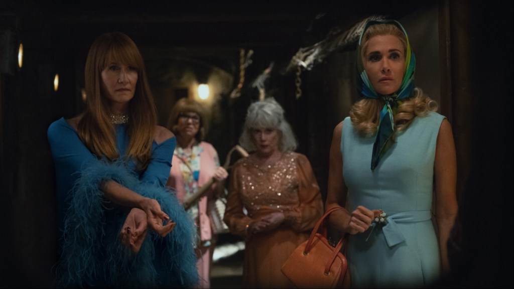 A group of women stare and look.