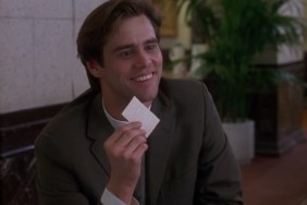 Jim Carrey puts up a piece of paper.