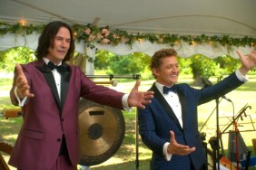 Keanu Reeves and Alex Winter put their hands out.