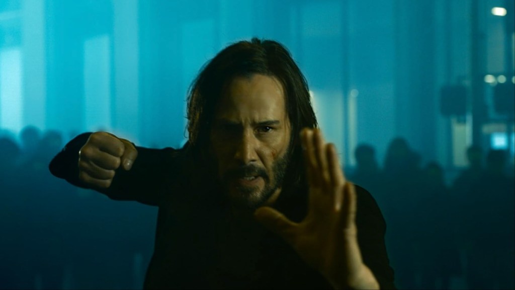 Keanu Reeves sets up to punch.