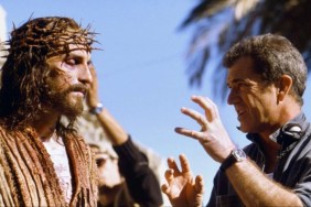 Mel Gibson talks to an actor dressed as Jesus.