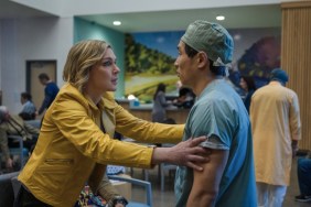 A woman puts her hands on a doctor.