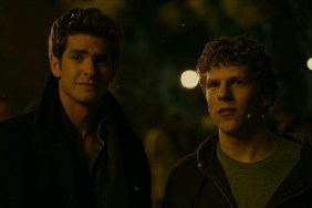 Two men stand next to each other and stare.