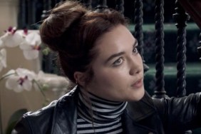 Florence Pugh leans and stares in Malevolent.