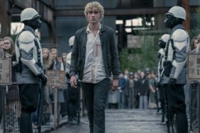 A young boy walks in the middle of soldiers in The Hunger Games: Sunrise on the Reaping.