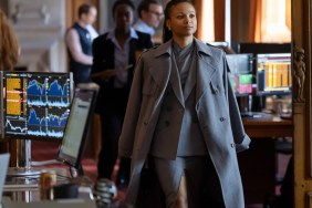 A woman walks in a coat in HBO's Industry.
