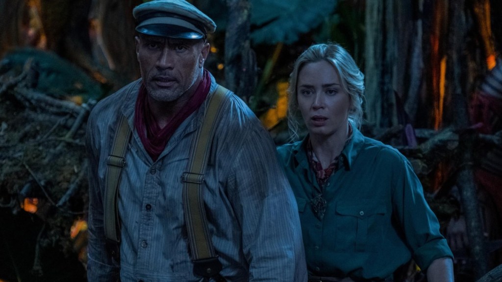 Dwayne Johnson and Emily Blunt walk together in Jungle Cruise.