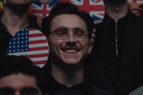 Timothee Chalamet holds up a paddle in Marty Supreme.
