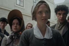 Amanda Seyfried stares in front of people.