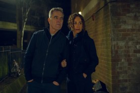 A man and woman stand next to each other in Run Away.