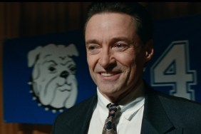 Hugh Jackman smirks in Bad Education.