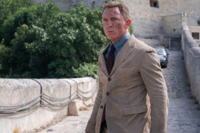 Daniel Craig stands on a bridge in No Time To Die.