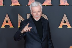 James Cameron points on the red carpet.
