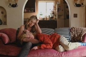Michelle Pfeiffer holds Elle Fanning on a couch in Margo's Got Money Troubles.