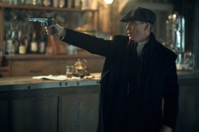 Cillian Murphy points a gun in Peaky Blinders.