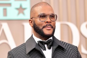 Tyler Perry smiles on the red carpet.