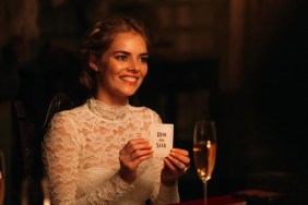 Samara Weaving holds a card in Ready or Not.
