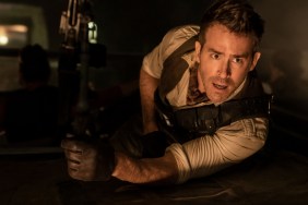 Ryan Reynolds looks on in Red Notice.