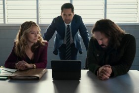 Mickey Haller stands in front of a table in Netflix's The Lincoln Lawyer.