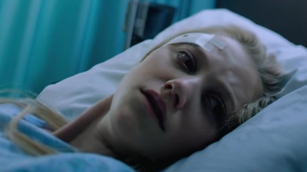 Maika Monroe in a bed in It Follows.