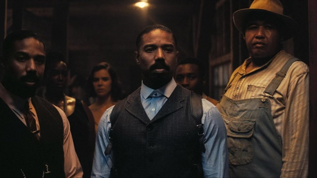 Michael B. Jordan stands in Sinners.