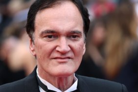 Quentin Tarantino poses on the red carpet.