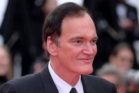 Quentin Tarantino poses on the red carpet.