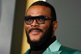 Tyler Perry posing on the red carpet.