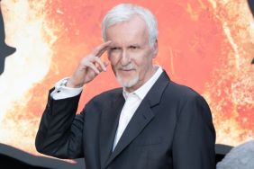 James Cameron poses on the red carpet.