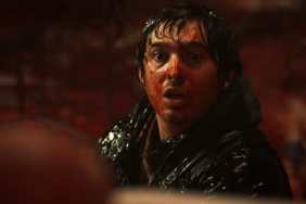 A bloodied Austin Abrams looks along in Resident Evil.