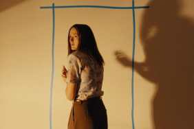 Renate Reinsve in front of a wall in Backrooms.