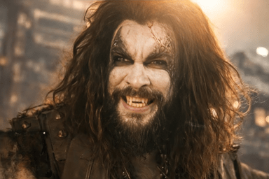 Jason Momoa Arrives at Supergirl Premiere in Peak Lobo Fashion