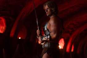 Nicholas Galitzine wields a sword in Masters of the Universe.