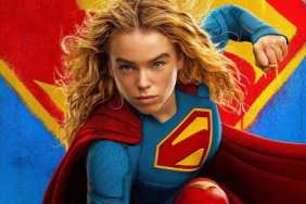 Milly Alcock holds up a fist as Supergirl.