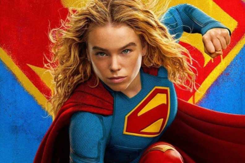 Milly Alcock holds up a fist as Supergirl.