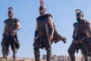 Matt Damon and two other soldiers stand in The Odyssey.