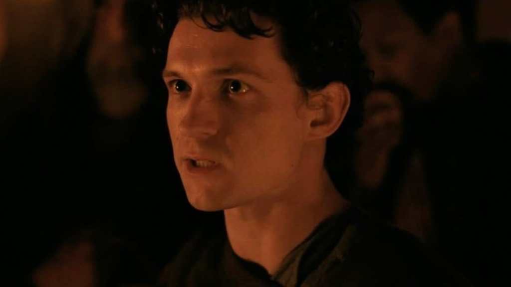 Tom Holland looks on in The Odyssey.