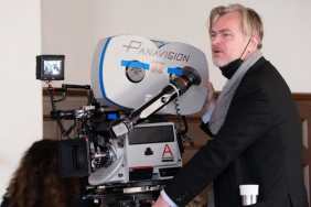 Christopher Nolan stands behind the camera.