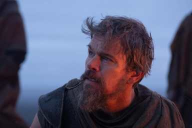 Matt Damon looks up in The Odyssey.