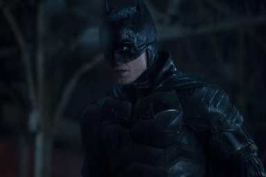 Robert Pattinson stares as The Batman.